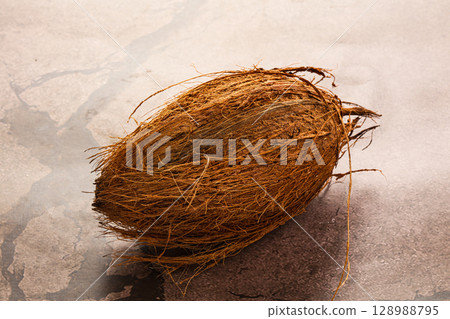 Natural exotic brown hairy coconut Natural exotic brown hairy coconut 128988795