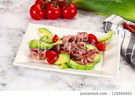 Salad with baby octopus and avocado 128988883