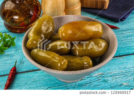 Homemade pickled green tomato heap Homemade pickled green tomato heap 128988917
