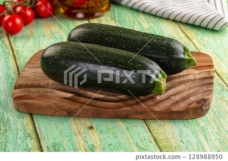 Young fresh raw green zucchini 128988950