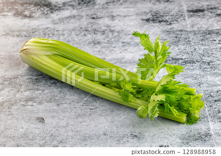 Raw green selery stem with leaves 128988958
