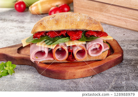 Ciabatta with mortadella, tomato, cheese and spinach Ciabatta with mortadella, tomato, cheese and spinach 128988979