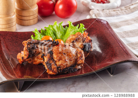 Hot Grilled chicken thigh barbecues 128988988