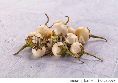 Raw white small baby eggplant Raw white small baby eggplant 128989096