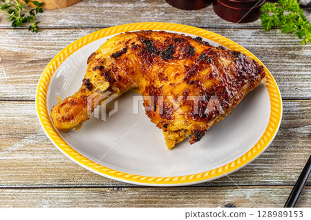 Roasted chicken leg with spices Roasted chicken leg with spices 128989153