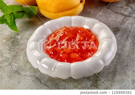 Sweet homemade juicy apricot jam Sweet homemade juicy apricot jam 128989162