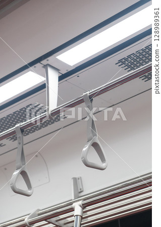 Hand grip inside the train of SRT Dark Red Line. It is a rapid transit line operated as part of the MBTA subway system from Bangkok to Rangsit 128989361