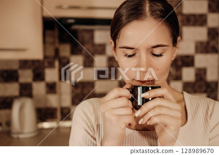 Woman Coffee Kitchen: Enjoying Morning Beverage Home Relaxation Woman Coffee Kitchen: Enjoying Morning Beverage Home Relaxation 128989670