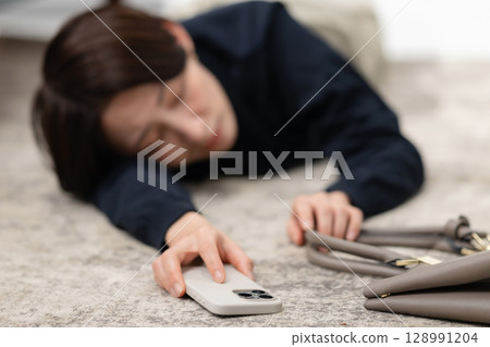 A tired woman falling asleep 128991204