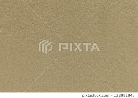 Texture of beige paper background, macro. Structure of brown craft cardboard. Vintage backdrop closeup 128991943