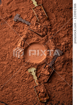 Cocoa powder chocolate texture background 128991986