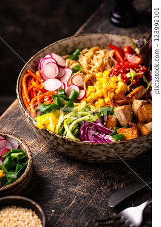 Vegan healthy poke bowl with tofu Vegan healthy poke bowl with tofu 128992101
