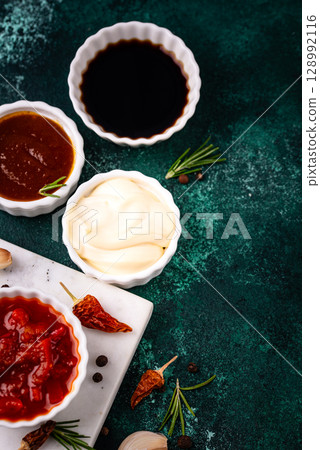 Set of different sauces. Ketchup, mustard, pesto Set of different sauces. Ketchup, mustard, pesto 128992116