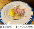 Traditional Dutch dish Herring - a dish of salted herring and onions with lemon 128992260