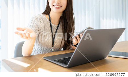 Smiling woman/businesswoman having a conversation Smiling woman/businesswoman having a conversation 128992277