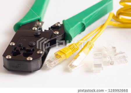 Modular plug crimpers for RJ-45, white background, Crimper, Twisting Cable Tool for Crimping RJ 45 LAN cable 128992668