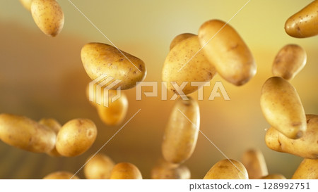 Freeze motion of flying early potatoes , Close-up 128992751