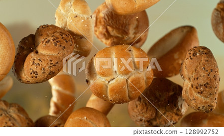 flying fresh savoury pastries on a blurred background flying fresh savoury pastries on a blurred background 128992752
