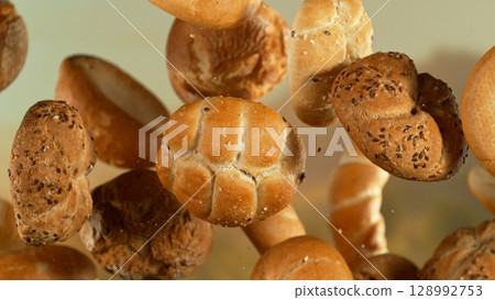 flying fresh savoury pastries on a blurred background 128992753