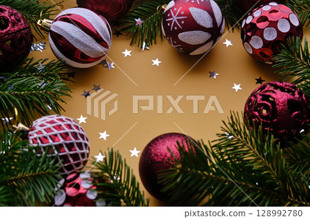 Christmas new year yellow background. Place for the text in Christmas decoration. 128992780