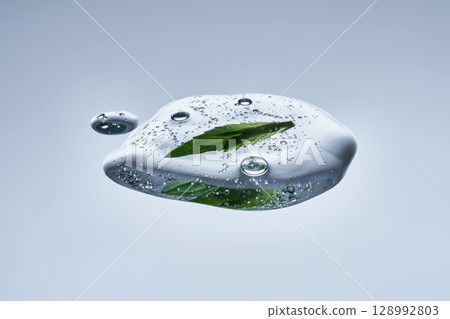 A drop of natural cosmetics with a mint leaf. 128992803