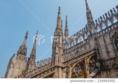 gothic spires on the rooftop of Milan Cathedral gothic spires on the rooftop of Milan Cathedral 128992892