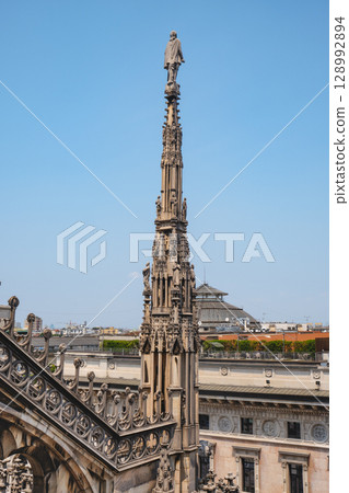 a pinnacle rises over Milan and the Galleria 128992894