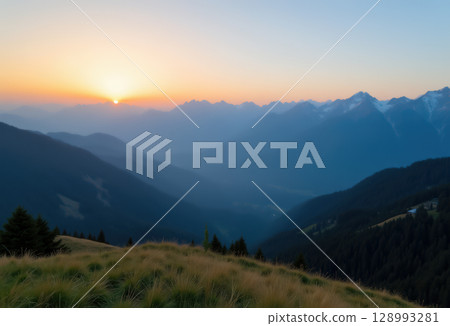 Sunrise over misty mountain landscape 128993281