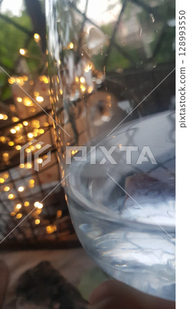 A close-up shot captures the enchanting glow of warm fairy lights nest 128993550