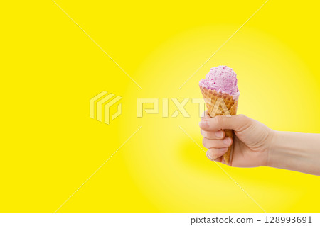 Colorful cone summer treat against bright backdrop Colorful cone summer treat against bright backdrop 128993691