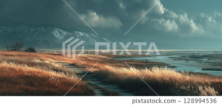 Twilight landscape of grass and mountains 128994536