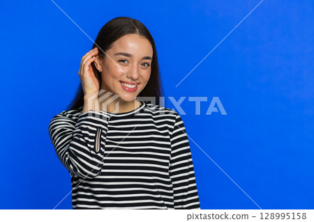 Happy Caucasian young woman smiling looking at camera dreaming, resting, good news feel satisfied 128995158