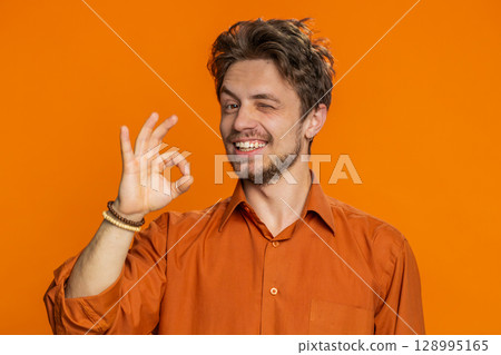 Happy Caucasian man showing ok gesture, like sign positive feedback, celebrate victory, approve idea Happy Caucasian man showing ok gesture, like sign positive feedback, celebrate victory, approve idea 128995165
