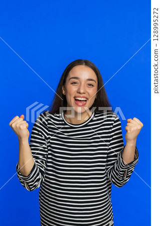 Happy Caucasian woman celebrate success winning birthday lottery jackpot goal achievement good news Happy Caucasian woman celebrate success winning birthday lottery jackpot goal achievement good news 128995272