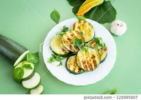Fried zucchini slices in a healthy food style 128995607