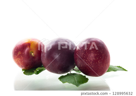 Blushed stone fruits emphasis on the texture of the peel Blushed stone fruits emphasis on the texture of the peel 128995632