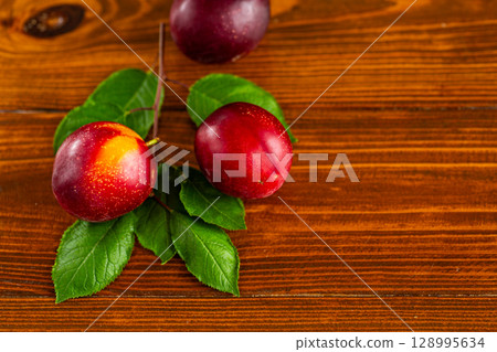 Organic farm plums close-up with space for text 128995634
