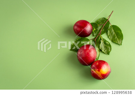 Summer garden fruits plums minimalist composition with copyspace 128995638