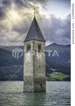 The iconic submerged Church Tower of Graun, Lake Reschensee, Italy 128996098