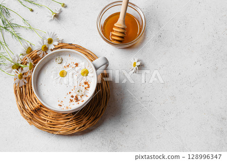 Chamomile tea and honey latte coffee 128996347