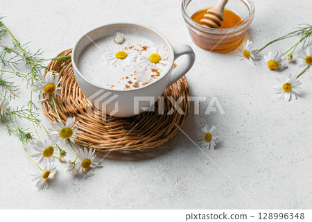 Chamomile tea latte with honey, raf coffee cup. Moon milk. 128996348