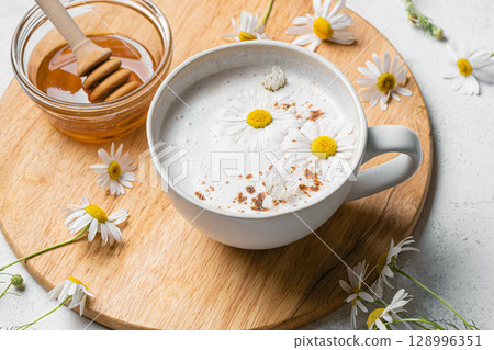 Chamomile tea latte with honey, raf coffee cup 128996351