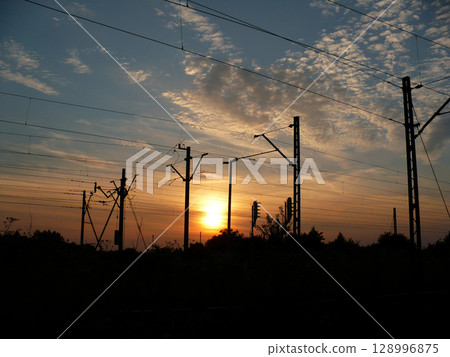 sunset over traction railroad tracks sunset over traction railroad tracks 128996875