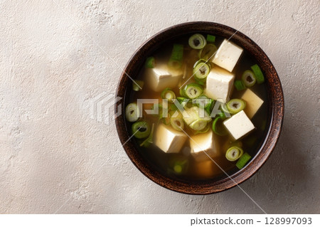 Top-Down View of Vegan Miso Soup with Tofu and Scallions 128997093