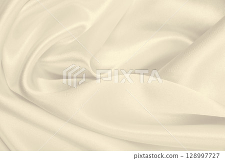 Smooth elegant golden silk or satin luxury cloth texture as wedding background. Luxurious background design. In Sepia toned. Retro style 128997727