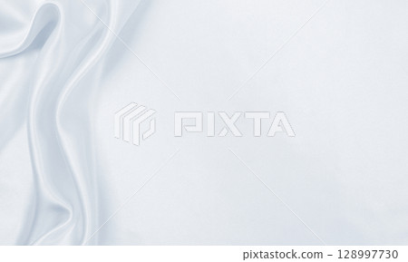 Smooth elegant grey silk or satin luxury cloth as wedding background. Luxurious Christmas background or New Year background design 128997730