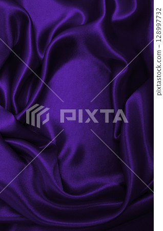 Smooth elegant lilac silk or satin luxury cloth texture as abstract background. Luxurious background design 128997732