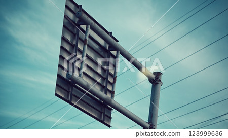 Behind the road sign 128999686