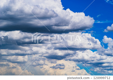 Cumulus and cumulonimbus clouds covering the summer sky b-2 High saturation contrast 128999712