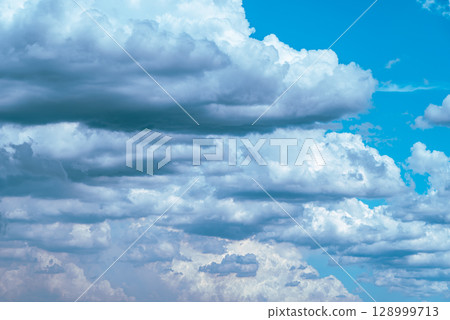 Cumulus and cumulonimbus clouds covering the summer sky b-3 light color Cumulus and cumulonimbus clouds covering the summer sky b-3 light color 128999713